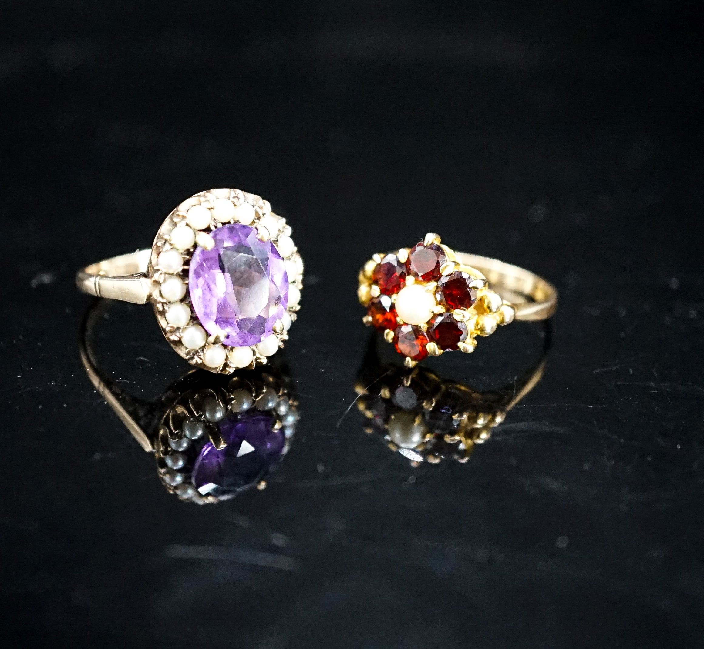 A 9ct garnet and cultured pearl ring and a 9ct gold amethyst and seed pearl mounted ring, gross 9.4 grams.